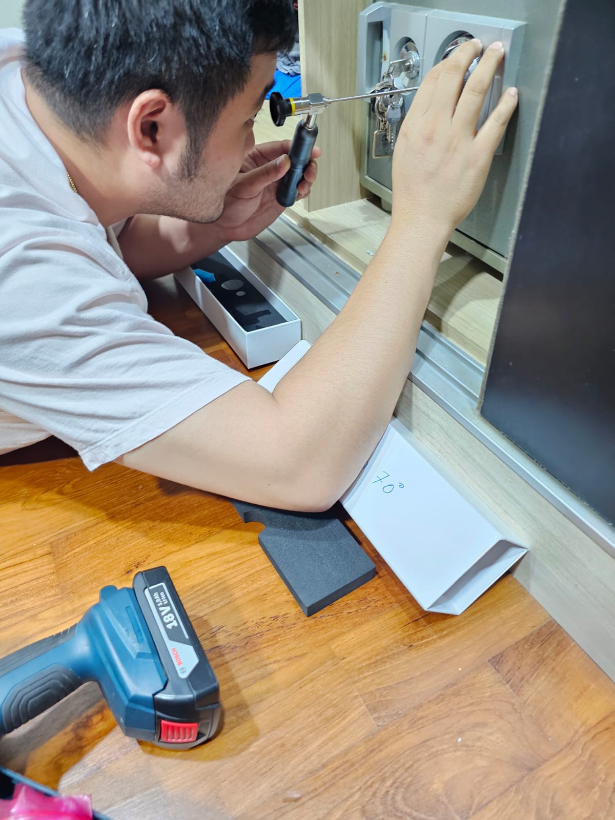 Alex Locksmith working on a safe during an unlocking job