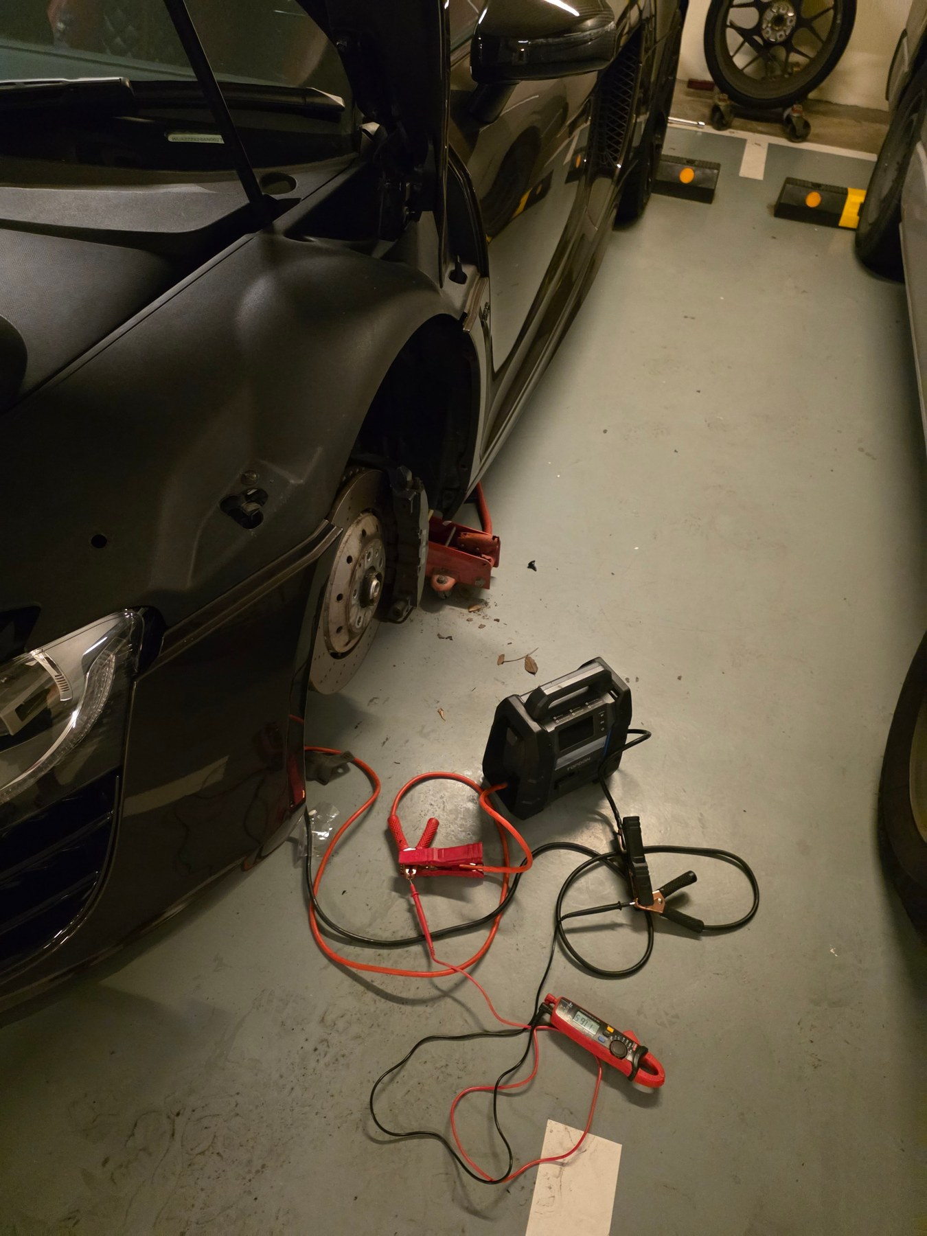 Vehicle with a flat battery and external power equipment at the scene
