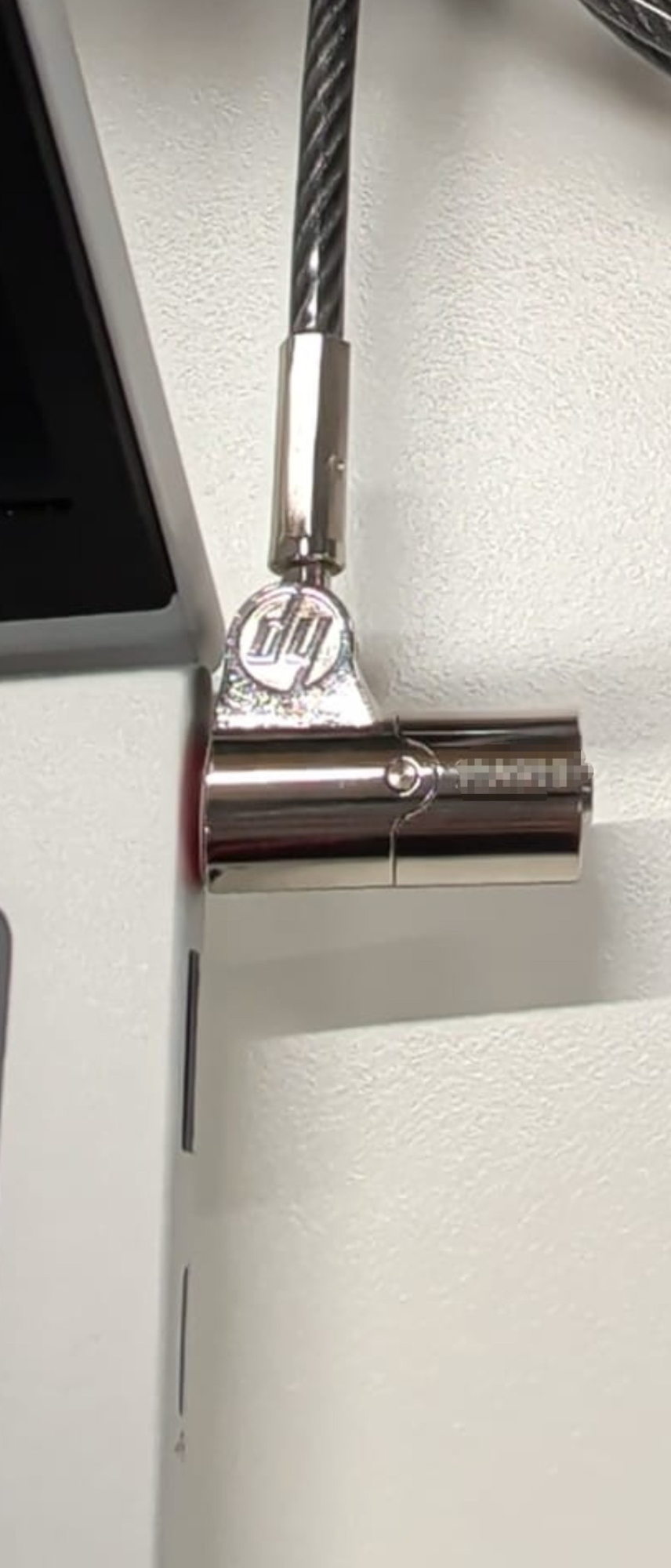Laptop security cable lock attached to a laptop