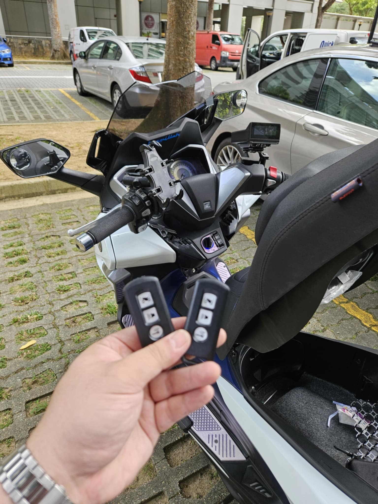 Motorcycle keyless FOB duplicate beside the motorcycle